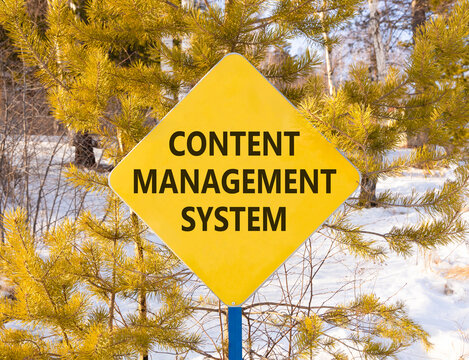 Content management system symbol. Concept words Content management system on beautiful yellow road sign. Beautiful winter forest background. Business content management system concept. Copy space.