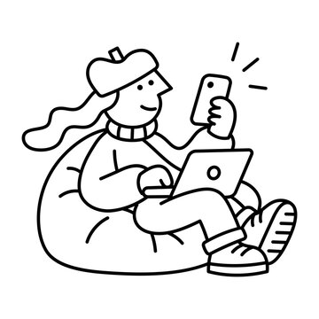 A woman sits cross-legged with a laptop on her lap while holding a smartphone, managing work across two devices from a relaxed seated position.