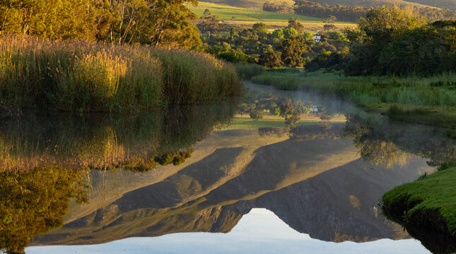 sunrise over the Klein River and Klein Mountains 
 Stanford, South Africa