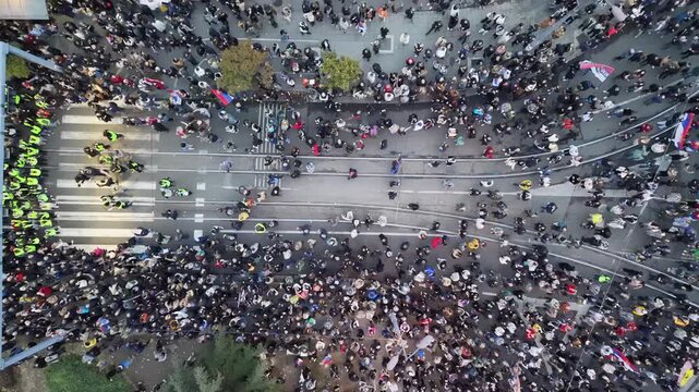 Beograd, Serbia - 22 October 2026: Aerial view of a large crowd of protesters gathered at Slavija Square.