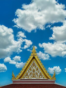 Golden thai style gable roof with blue sky
