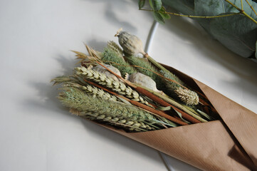 Dried flowers, lavender and eucalyptus with craft supplies for a wreath © bevisphoto