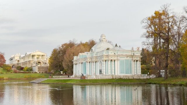 A serene Grotto pavilion stands by a calm lake in Catherine Park, Pushkin, Russia. A peaceful slow motion view captures its tranquil beauty.