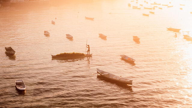 Ocean with boats in Lembongan island in Indonesia. Algae farm with morning warm sunlight
