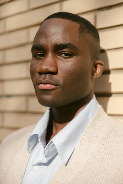Close Up Portrait Against Brick Wall