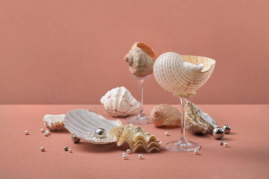 Seashells on glass stems with pearls, terracotta
