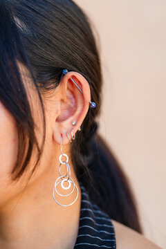 closeup pierced ears earrings various