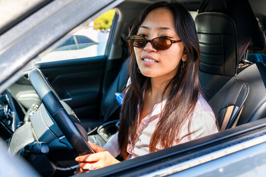 driver looking at side mirror