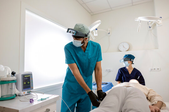 Medical professional using capillary injector during