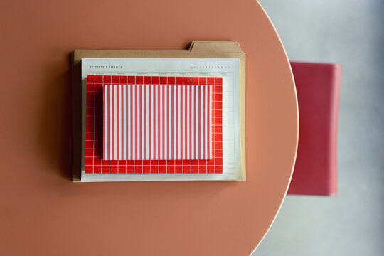 Overhead Planner And Stationery On Coral Desk