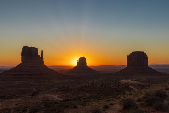 Spectacular Sunrise Behind the Mittens and Merrick Butte in Monument Valley Arizona