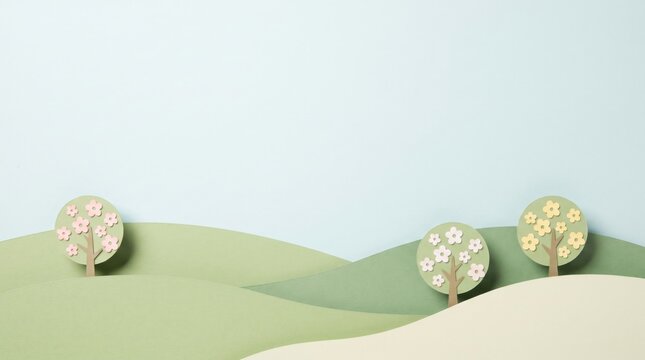 Layered paper spring hills with tiny flowering trees