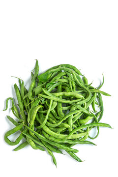 Green Beans Piled on a White Surface
