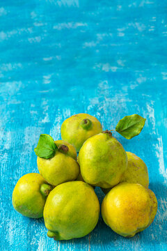 Guavas Arranged on a Blue Painted Surface