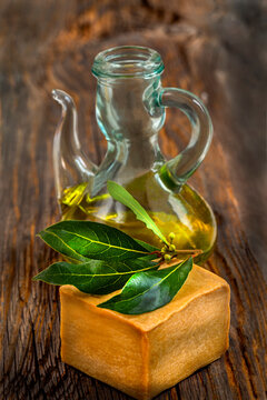 Olive Oil and Herbs on a Wooden Table