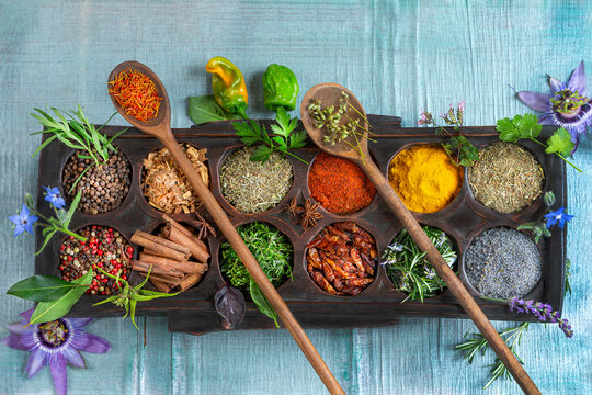 Spices and Herbs Arranged on a Wooden Tray