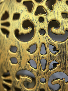 Intricate golden design revealing artistry and craftsmanship in metalwork