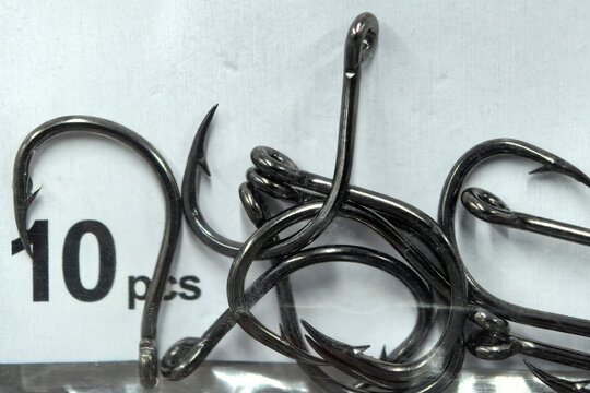 Tangled steel hooks beside a ten-piece label