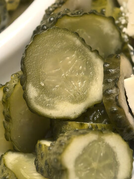 Tangy pickle slices glistening in a quiet kitchen moment