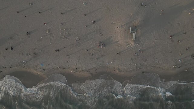 Aerial view of waves breaking on the beach in Santa Monica