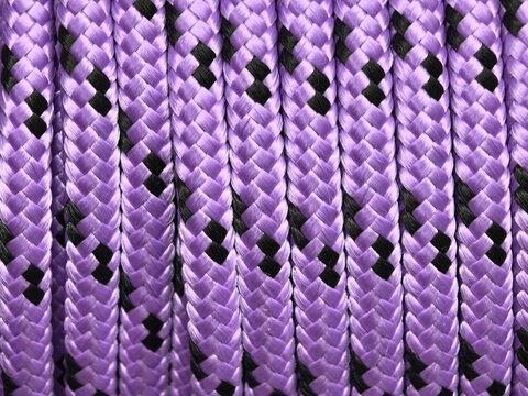 Violet braids weaving a bold pattern of light and shadow