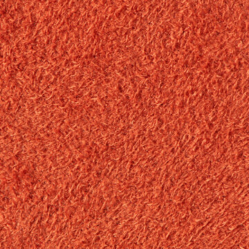 Close up of orange suede leather texture with a soft fuzzy nap