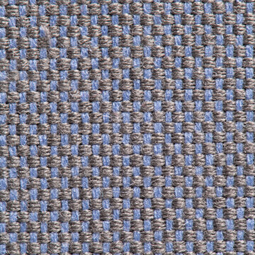 Close up of blue and brown woven fabric texture with a geometric check pattern