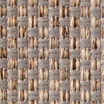 Close up of multi-color woven fabric texture with intersecting beige and grey threads