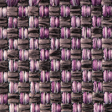 Close up of purple and dark woven fabric texture with a geometric basket weave pattern