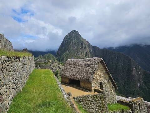 Breathtaking high-altitude view of the historic Inca citadel of Machu Picchu nestled in the Andes mountains of Peru.
