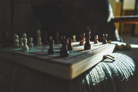 Low-Angle View of a Wooden Chess Board in Atmospheric Light