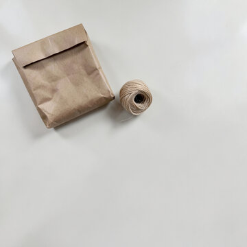 Kraft parcel and cotton cord viewed from above