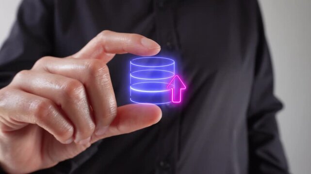 Close-up of the hands of a woman holding between her two fingers a virtual icon of a database with an arrow that ascends