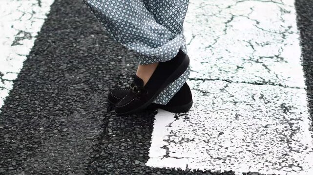 Close-Up of Feet Crossing Pedestrian Crosswalk, Slow Motion
