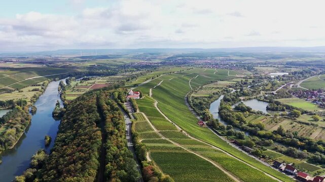The Mainschleife near Volkach winds through the valley and is surrounded by fields and vineyards. Volkach, Kitzingen, Lower Franconia, Bavaria, Germany