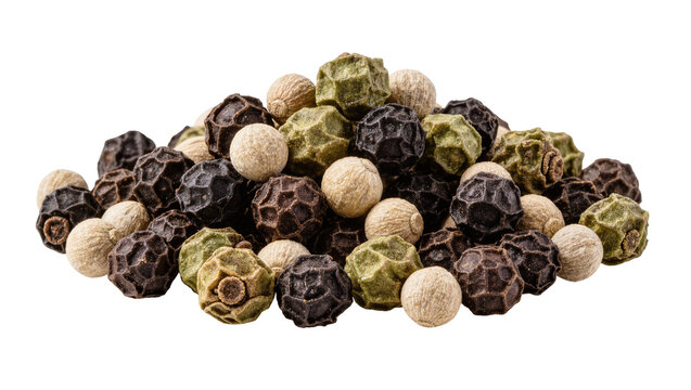 Isolated pile of various dried peppercorns including black, white, and green spices