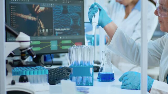 Pipette, sample and test tube close-up with a senior woman measuring liquid into laboratory glassware beside blue solution, for specimen preparation, biotechnology experiments and medical research.