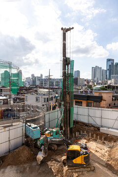  Drilling machine on the construction site. Drilling holes in the ground.