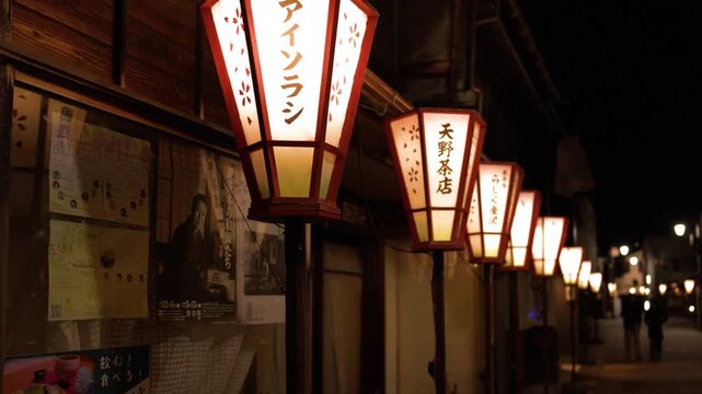 Illuminated Traditional Paper Lanterns Along Historic Street in Kanazawa at Night