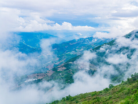 Aerial View of Misty Mountain Valley and Terraced Fields