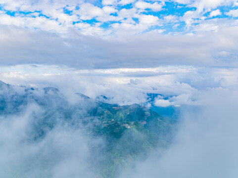 Aerial view of misty green mountains and clouds in Nantou