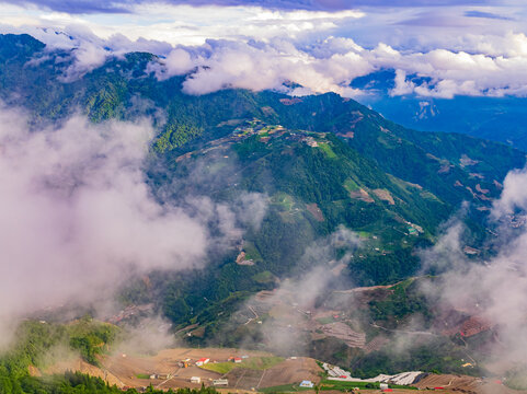 Aerial view of misty mountains and terraced fields in Nantou