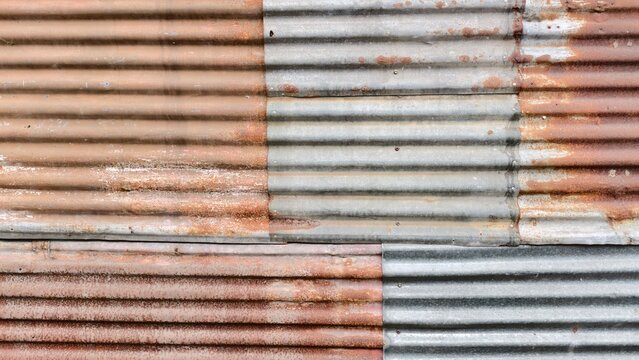 a weathered, industrial surface composed of overlapping corrugated metal sheets