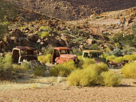 Car wrecks near the Namtib Desert Lodge in the Tiras Mountains, Namibia, Africa