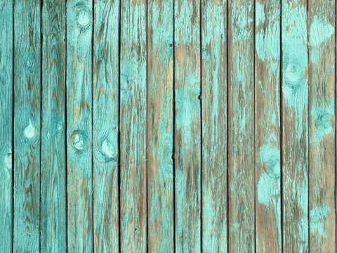 Weathered wooden planks with peeling turquoise paint showing natural grain and knots, top view texture background for rustic coastal design purposes, even soft light emphasis on surface detail