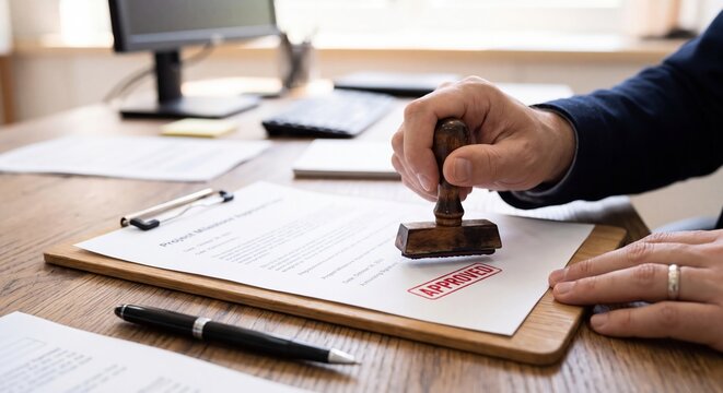 A businessman stamping an approved document on a wooden office desk on transparent background