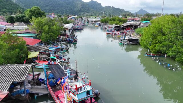 26,Otc,2026,Pranburi Thailand,Aerial video shows fishing villages along rivers and coastlines in various provinces of southern Thailand, where villagers use motorboats of different sizes to catch fish