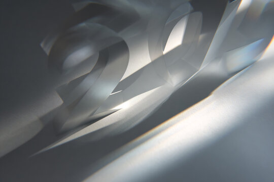 Glowing translucent number typography casting dramatic shadows under bright lighting