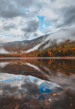 Autumn mountains reflecting in a lake in Franconia Notch State Park