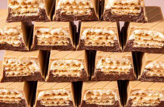 Rows of delicious chocolate covered wafers arranged symmetrically